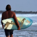 Donavon Frankenreiter surfing on Jay Alders art surfboard