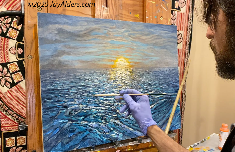 Jay Alders painting a seascape