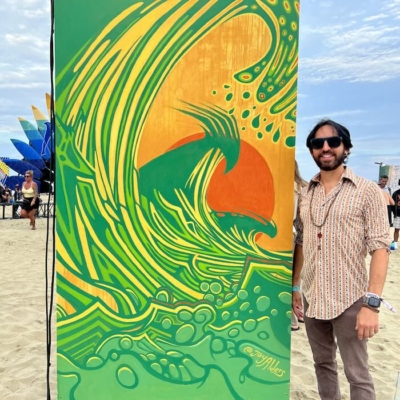 Jay Alders' modern mural at Sea Hear Now 2023, featuring an elongated surfer on a dynamic wave, vibrant in color and emotion