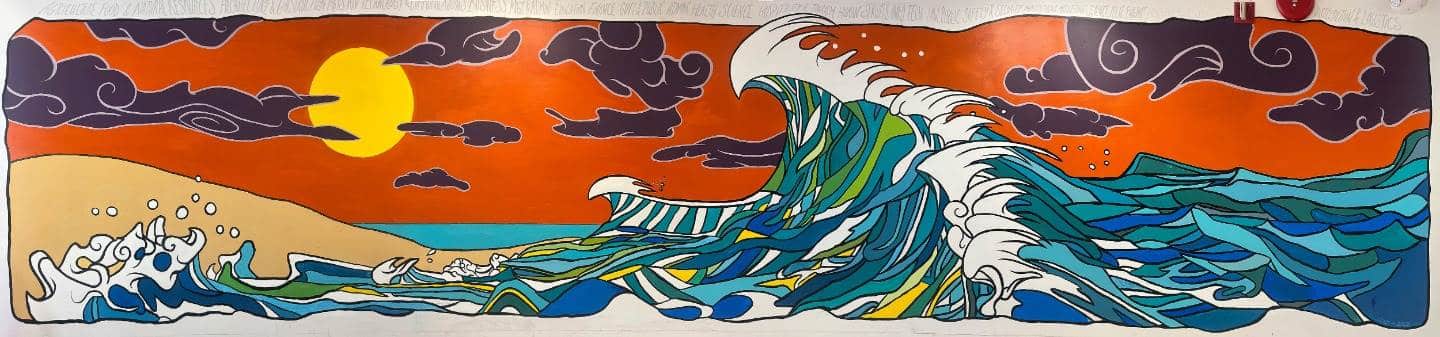 Wall mural at Toms River East Intermediate School with ocean surf themed muralist and artist Jay Alders